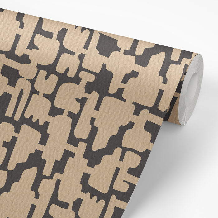 Wallpaper roll preview of Abstract Shapes Wallpaper in Beige on Charcoal.