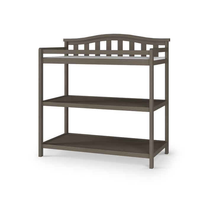 The Child Craft Arch Top Baby Changing Table in Dapper Gray features a dark wood finish, an arched slat-style back, open design, and two lower shelves—an elegant and practical addition to your nursery collection.