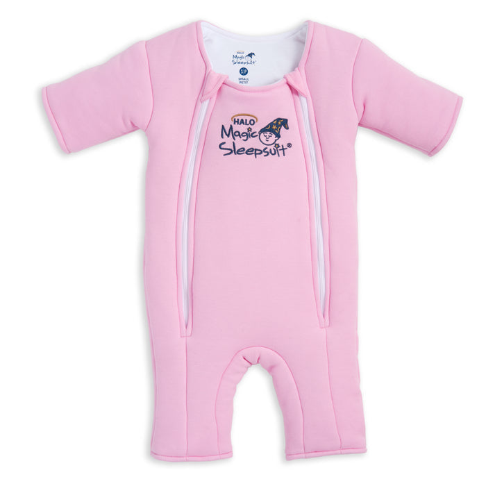 The HALO Baby Merlin's Magic Sleepsuit® 100% Cotton is a pink, long-sleeved, footed baby sleepsuit with two front zippers and a chest logo featuring a sleeping moon—ideal for swaddle transition.