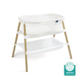 The HALO BassiNest® Essential Sleeper is a white mesh bassinet with wooden legs, mesh walls, a storage shelf underneath, and a space-saving design. A Baby Safety Alliance Verified badge appears in the bottom right corner.