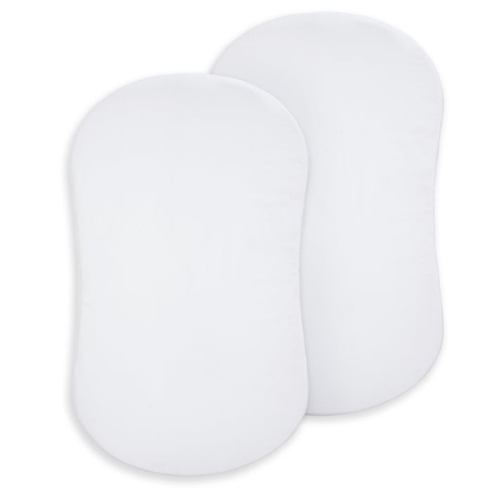 Two white, oval-shaped pads made of 100% organic cotton are shown side by side. These HALO BassiNest® Fitted Sheets come in a 2-pack and are ideal for use as newborn bassinet sheets.