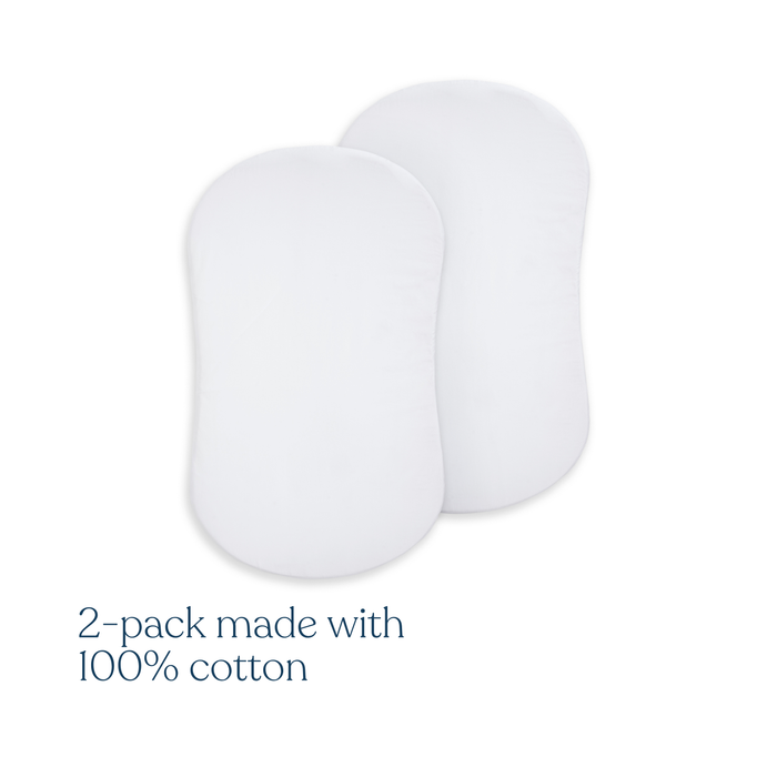 Two white, curved rectangular pads overlap on a white background. Below, text reads: HALO BassiNest® Fitted Sheet 100% Organic Cotton 2-Pack.