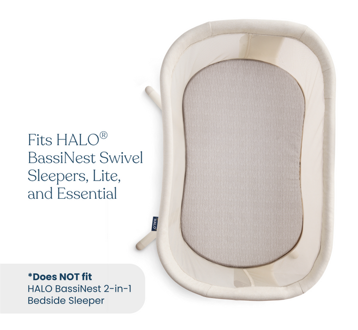 Top view of an oval bassinet with a light beige frame and striped mattress. Fits HALO BassiNest Swivel Sleepers, Lite, and Essential; use with HALO BassiNest® Fitted Sheet 100% Organic Cotton 2-Pack—not for the 2-in-1 Bedside Sleeper.