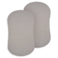 Two rectangular, storm grey, 100% organic cotton muslin pads overlap on a white background—perfect as HALO BassiNest® Fitted Sheet 2-Pack for breathable, comfortable baby bedding.