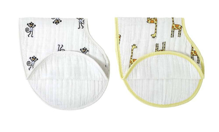 This aden + anais set includes two boutique 100% cotton muslin burpy bibs. One bib features black monkeys with yellow trim, and the other highlights giraffes, both designed for superior functionality and style with their absorbent quilted muslin fabric.