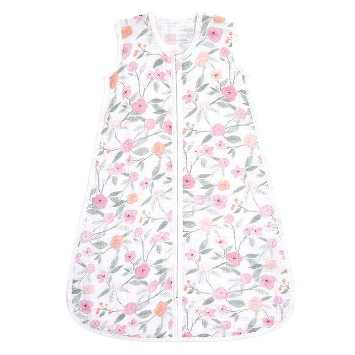 The aden + anais boutique 100% cotton muslin light sleep sack TOG 1.0 features a white sleeveless design with a pink, orange, and green floral pattern. It is crafted from breathable cotton muslin and includes a front zipper for comfort and style.