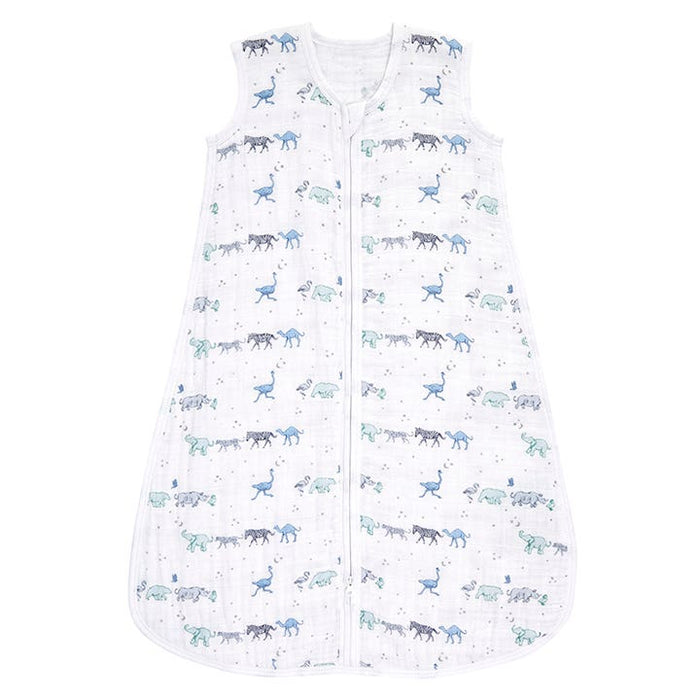 The aden + anais Boutique sleep sack is a lightweight, sleeveless design made from 100% cotton muslin. It features a front zipper closure and is decorated with blue, turquoise, and gray dinosaurs for ultimate comfort. TOG rating: 1.0.