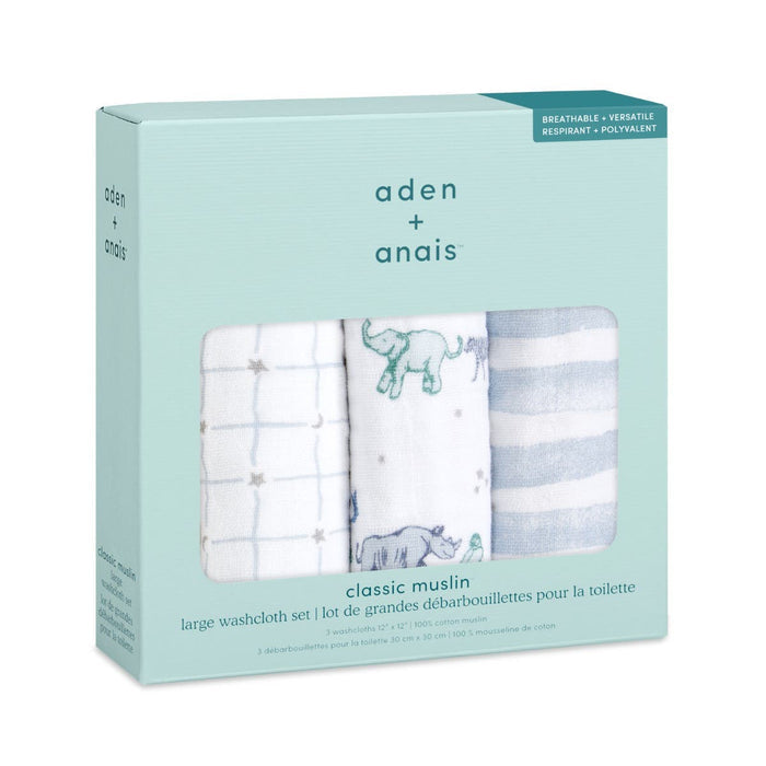 The aden + anais boutique 100% cotton muslin oversized washcloths 3 pack is ideal for delicate skin. The light teal box reveals three washcloths: one with a grid pattern, one with elephants and stars, and one with blue and white stripes. Designed with absorbent layers for gentle care.