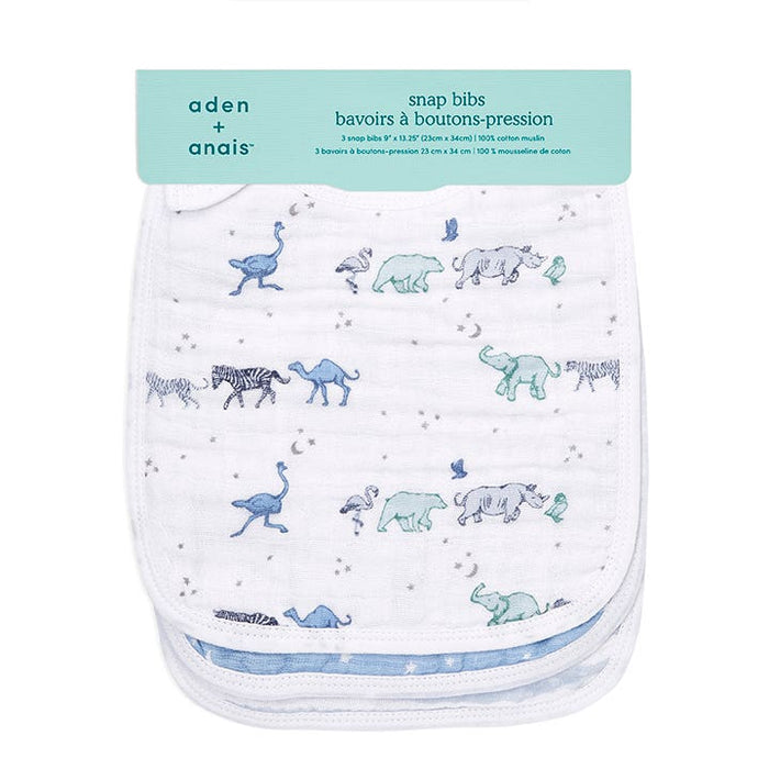 The aden + anais boutique 100% cotton muslin snap bibs 3 pack features playful animal illustrations—ostriches, zebras, elephants, and tortoises—in shades of blue and gray on white. Crafted from absorbent muslin with an adjustable fit, they are packaged in light blue.