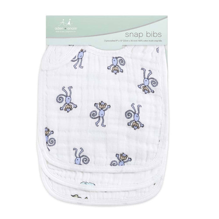 A 3-pack of aden + anais boutique snap bibs with charming blue and gray monkey designs, made from absorbent 100% cotton muslin, offering adjustable sizing for growing babies.