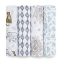 Four rolled-up boutique 100% cotton muslin swaddle blankets from aden + anais are displayed vertically, featuring giraffes, elephants, leopards, geometric shapes, and soft blue prints. These swaddles are absorbent, breathable, and colored in white, blue, brown, and black.