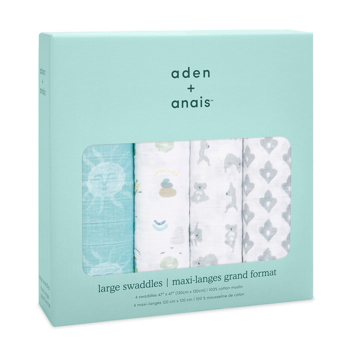The aden + anais boutique 100% cotton muslin swaddle blanket 4 pack includes large, breathable swaddles with patterns such as teal suns, white with small images, gray animal faces, and gray abstract shapes. The packaging displays product details in both English and French.