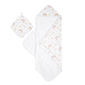 The aden + anais boutique set includes a charming white hooded cotton muslin towel and washcloth, featuring rainbows and abstract shapes in soft colors. The oversized towel has a cozy interior, while the matching square washcloth complements it beautifully.