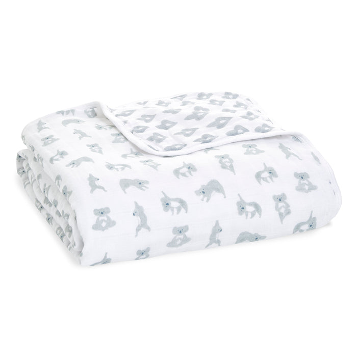 The boutique dream blanket by aden + anais is crafted from breathable, extra soft cotton muslin with a charming small gray koala bear pattern.