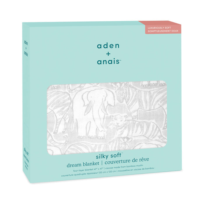 A boxed aden + anais boutique silky soft muslin dream blanket with a cozy gray safari animal print is visible through a cut-out. The light blue packaging emphasizes its four-layer bamboo-infused viscose muslin and silky softness.
