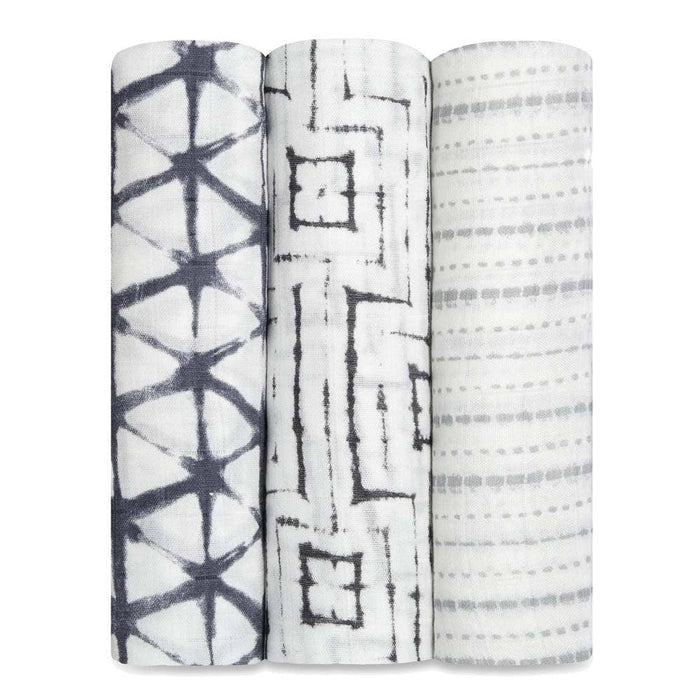 The aden + anais boutique silky soft swaddle blanket 3 pack includes three rolled muslin swaddles with black and gray geometric patterns: star-shaped intersecting lines, diagonal-lined squares, and dotted stripes. Made from bamboo-infused viscose, theyre irresistibly silky soft.