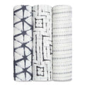 The aden + anais boutique silky soft swaddle blanket 3 pack includes three rolled muslin swaddles with black and gray geometric patterns: star-shaped intersecting lines, diagonal-lined squares, and dotted stripes. Made from bamboo-infused viscose, theyre irresistibly silky soft.