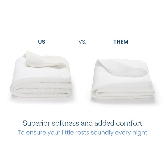 Two white mattress pads labeled US (HALO) and THEM, side by side. The HALO pad on the left is thicker and more plush, featuring a breathable crib mattress cover with waterproof lining for superior softness and comfort. Its machine washable for easy care.