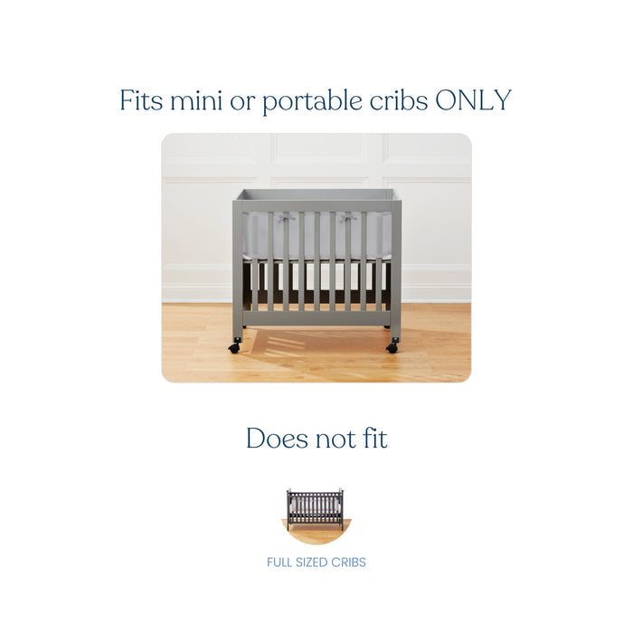 Image of a mini crib on a wooden floor with text Fits mini cribs ONLY. A smaller, crossed-out full-sized crib image reads Does not fit below. Ensure crib safety with HALOs Breathable Mesh Crib Liner for Mini Crib, providing peace of mind and comfort.