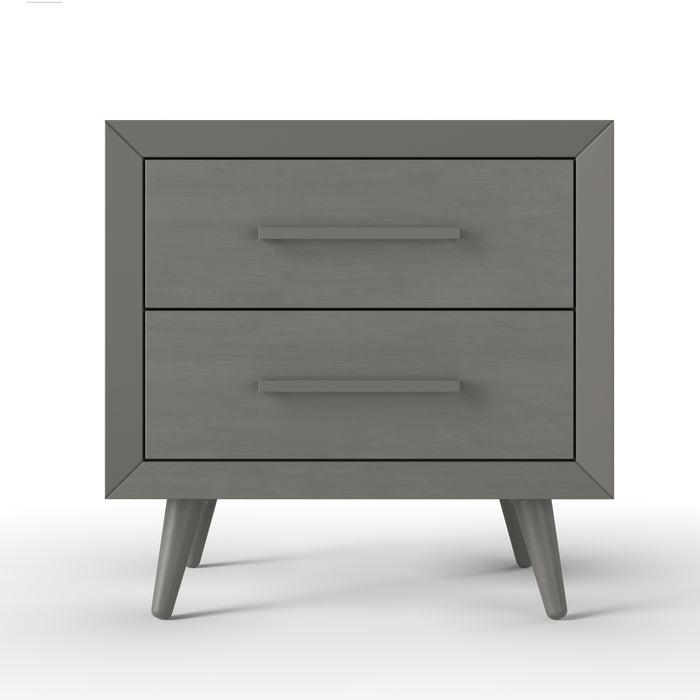 The Child Craft Cranbrook Nightstand in Lunar Gray features a modern, minimalist design with two drawers, angled legs, and sleek horizontal handles, all set against a plain white background.