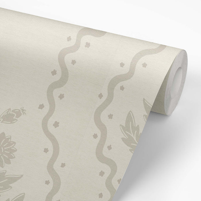Dandelion Block Printed Wallpaper in Beige shown on a wallpaper roll.