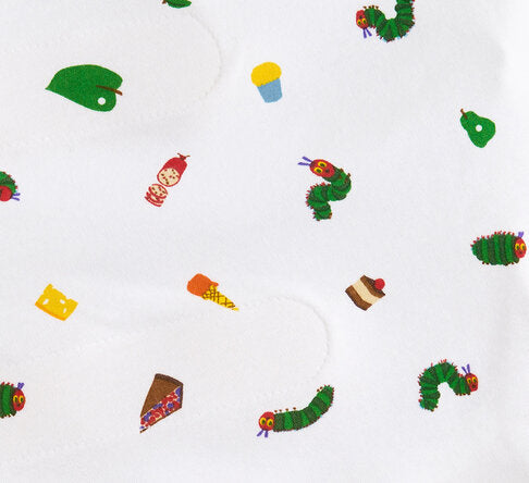 The HALO Eric Carle The Very Hungry Caterpillar 100% Cotton Swaddle TOG 1.5 features whimsical prints of the green caterpillar, cheese, cupcake, ice cream cone, and fruit on soft white fabric.