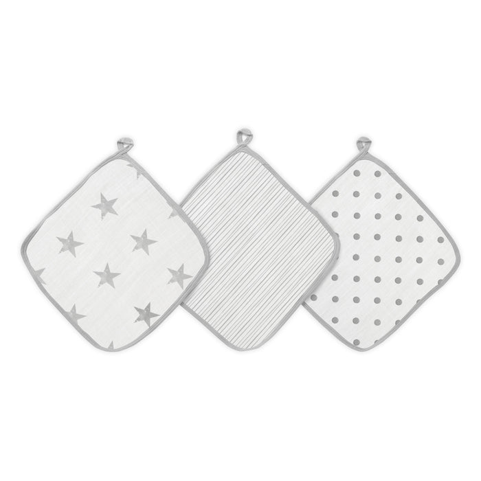 The aden + anais essential cotton muslin washcloths 3 pack includes three washcloths: one with gray stars, one with thin gray stripes, and one with gray polka dots. Each absorbent cloth features a convenient hanging loop at the top.