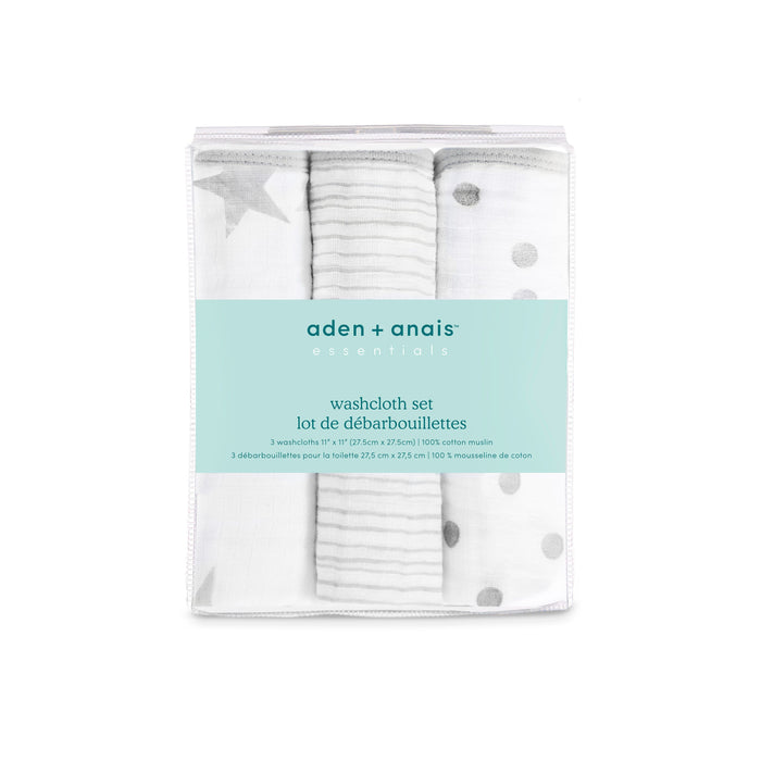 A teal-labeled package from aden + anais, the essential cotton muslin washcloths 3 pack includes three soft, absorbent washcloths with star, stripe, and polka dot designs in a gentle white and gray color palette. Perfect for delicate skin with all product details provided.