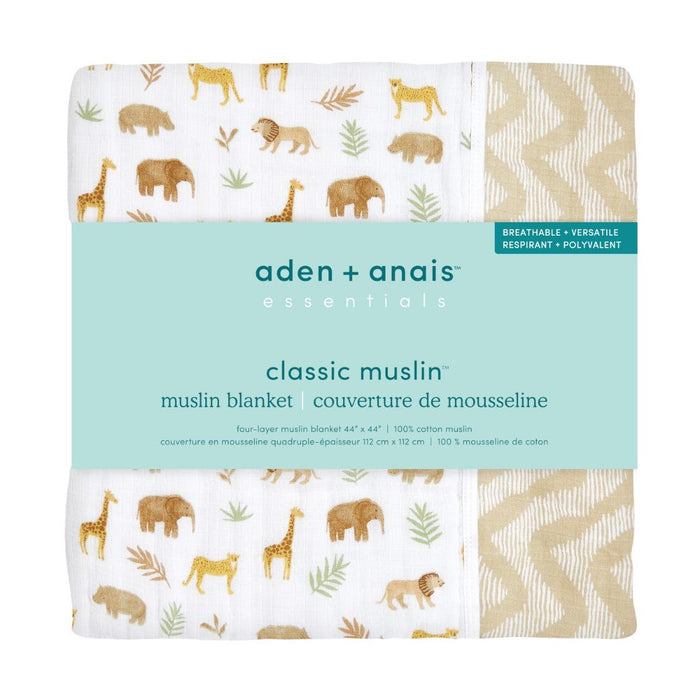 Packaged aden + anais essentials cotton muslin dream blanket. This cozy cloud has a white background with animal, leaf illustrations, and a beige geometric pattern. The label highlights it as breathable and versatile, ideal for a soft blankets collection.