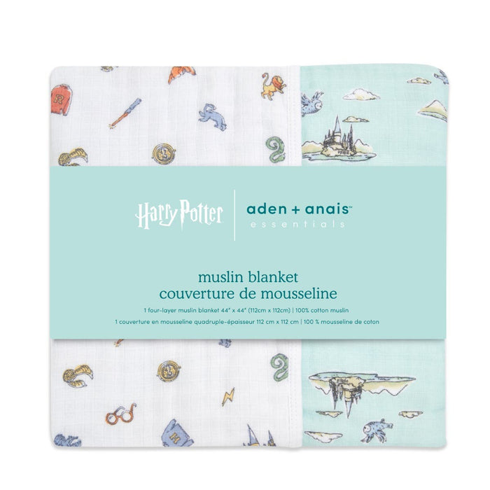 A pack of two cozy essentials cotton muslin dream blankets by aden + anais, featuring Harry Potter designs on a white and mint green background with castles, broomsticks, and magical creatures.