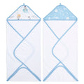 Displayed are two aden + anais essentials cotton muslin hooded towels. One features an outer space theme with planets and stars, while the other showcases a baby animal design with bears and balloons. Both white fabric towels are absorbent and gentle for your little one.