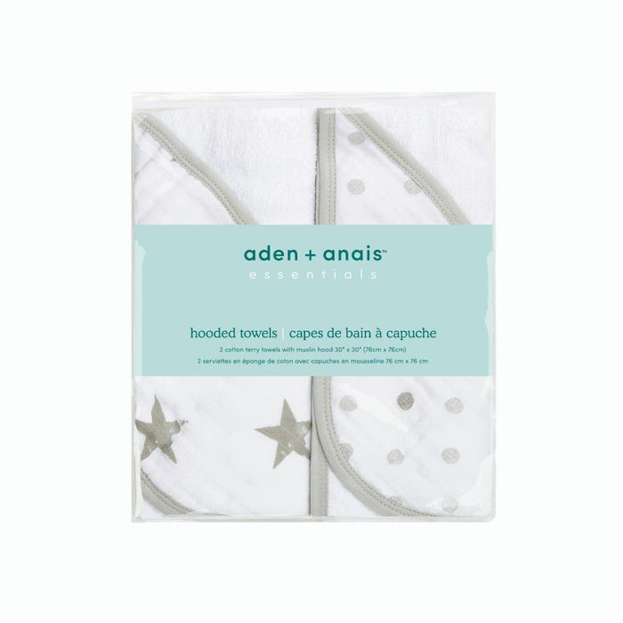 The aden + anais essentials cotton muslin hooded towels 2 pack features two plush, white cotton terry towels with charming gray star and polka dot designs. Each towel includes a comfortable cotton muslin hood, measuring 76 x 76 cm.