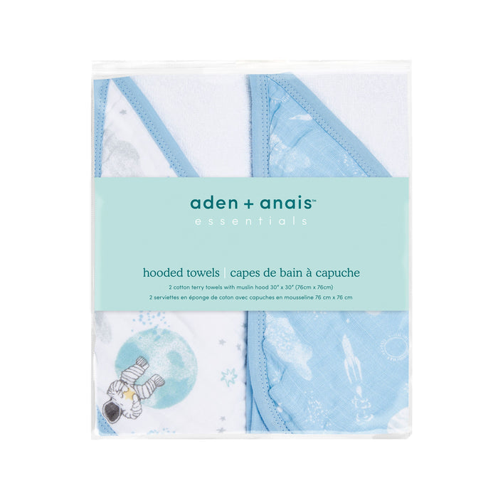 Explore aden + anais essentials cotton muslin hooded towels, a 2-pack featuring absorbent plush cotton terry in blue and white with space-themed illustrations of astronauts and moons. Ideal for a whimsical touch to bath time.