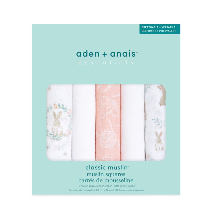 The aden + anais essentials cotton muslin musy squares 5 pack features breathable and versatile baby essentials, each with unique rabbit and floral patterns in pastel white, pink, and green.
