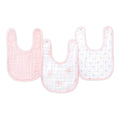 The aden + anais essentials cotton muslin snap bibs 3 pack includes a solid pink bib, a white one with pink stars, and another white featuring pink and gray polka dots.