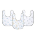 The aden + anais essentials cotton muslin snap bibs 3-pack features absorbent bibs with gray trim: a blue whale pattern on the left, dinosaurs in blue, yellow, and green in the center, and gray mice on the right. These bibs adjust easily as your baby grows.