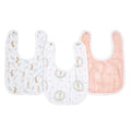 The aden + anais essentials cotton muslin snap bibs 3 pack includes a white bib with rabbit and leaf patterns, another with floral and rabbit designs, and a peach bib with an intricate line pattern. Made from absorbent cotton muslin, all feature secure snap closures for convenience.