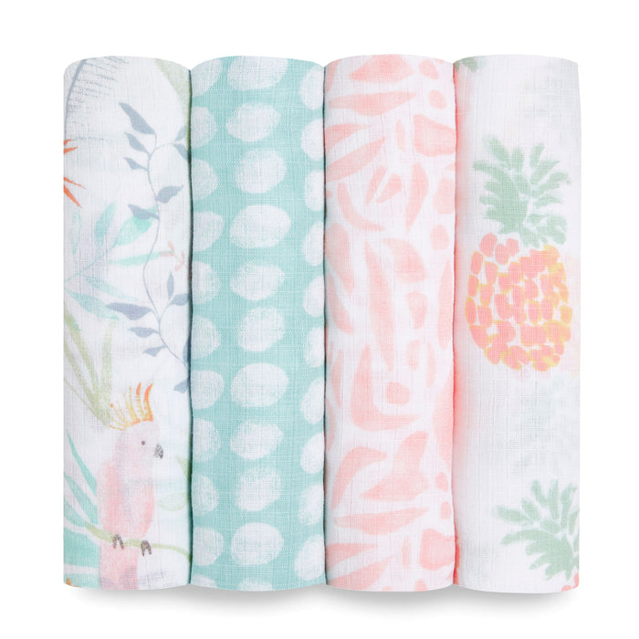 The aden + anais essentials cotton muslin swaddle blanket 4 pack includes four designs: tropical leaves with a bird, teal polka dots, pink abstract leaves, and a cute pineapple pattern.