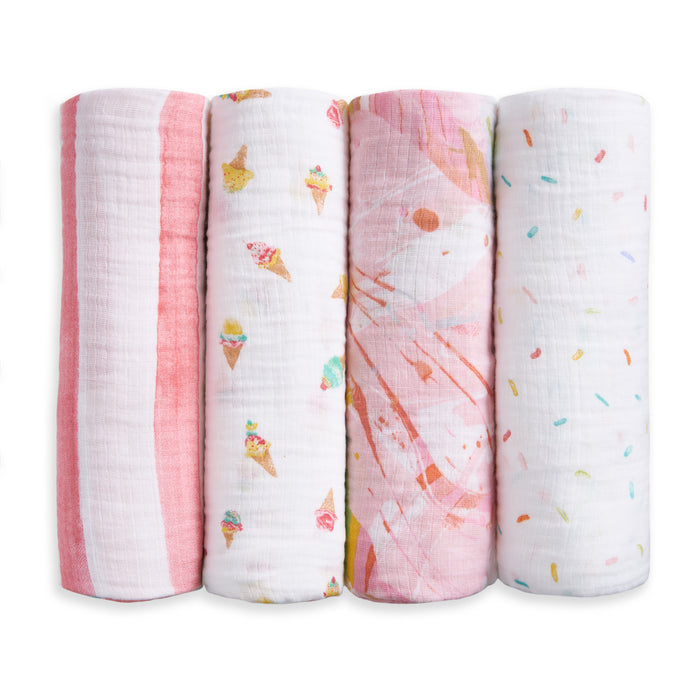 The aden + anais essentials cotton muslin swaddle blanket 4 pack features breathable baby blankets with pink stripes, ice cream cones, abstract shapes, and colorful sprinkles patterns—gentle on delicate skin.