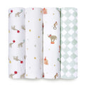 The aden + anais essentials cotton muslin swaddle blanket 4 pack features unique designs such as balloons with elephants, stars and circus tents, elephants on stools, and a green-white diamond pattern. Crafted from soft cotton muslin for ultimate comfort.