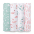 The aden + anais essentials cotton muslin swaddle blanket 4 pack features four vertically lined blankets: green with white flowers, white with pink flamingos, a pastel floral pattern on white, and white with pink abstract shapes, adding charm and practicality to any nursery.