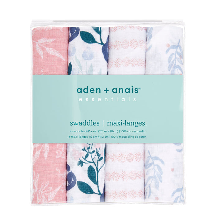 Explore the essentials cotton muslin swaddle blanket 4 pack by aden + anais, crafted with breathable cotton muslin fabric. This set showcases vibrant designs: pink with white leaves, dark blue leaves on white, pink geometric shapes on white, and light blue leaves on white.