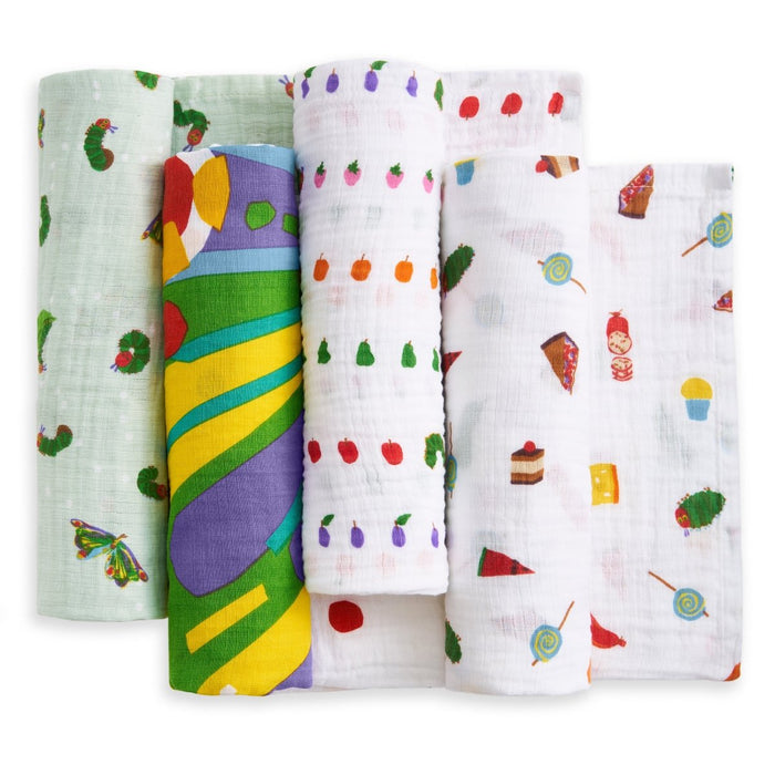 The aden + anais essentials cotton muslin swaddle blanket 4 pack includes playful designs: caterpillars and butterflies, abstract green and yellow swirls, plus two with assorted fruits, desserts, and treats on a white background.