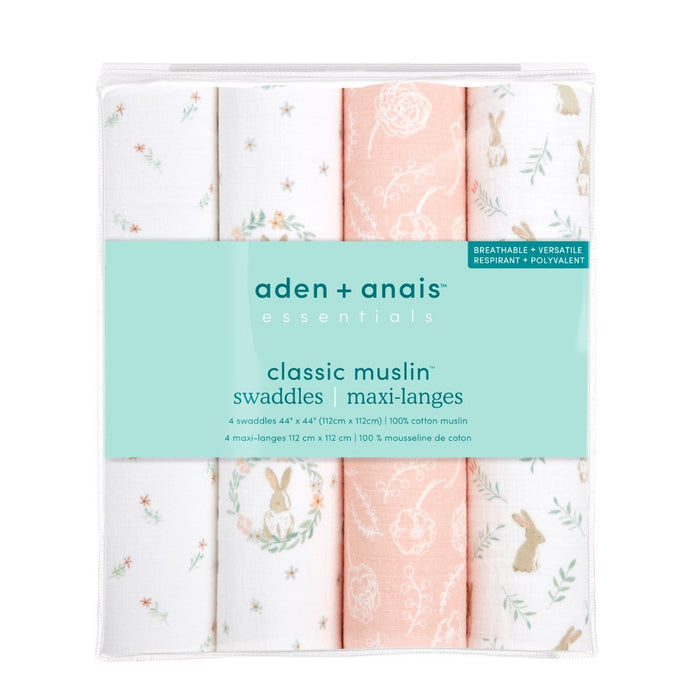 A pack of aden + anais essentials cotton muslin swaddle blanket includes four breathable 100% cotton swaddles, each 44 x 44, featuring soft pastel colors with floral and rabbit designs for ultimate comfort.