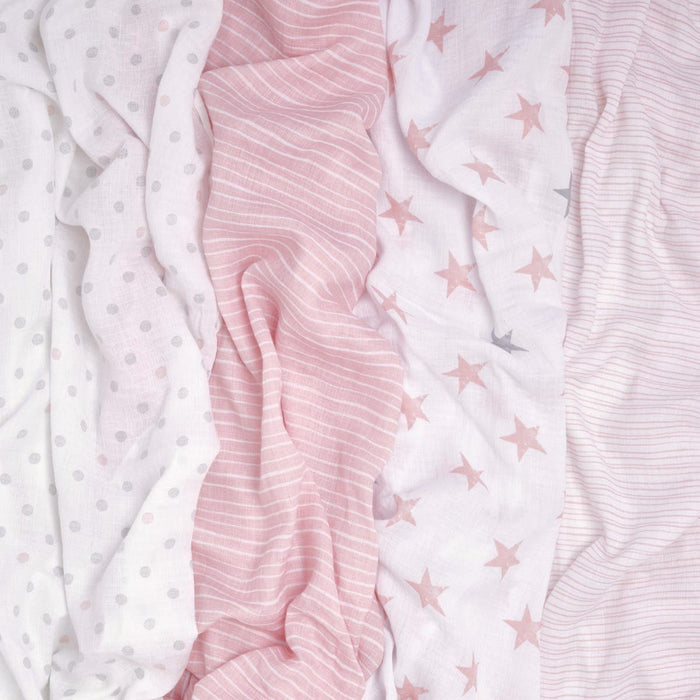 The aden + anais essentials cotton muslin swaddle blanket 4 pack features four breathable cotton fabrics in soft pink and white tones with polka dots, stripes, stars, and pinstripes, offering light and airy textures perfect for versatile baby blankets.