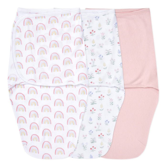 The aden + anais essentials easy swaddle wrap 3 pack includes a rainbow-patterned swaddle, a floral design, and a plain pink wrap. Designed to prevent the startle reflex, these swaddles provide comfort and security.