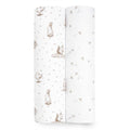 Two rolls of aden + anais essentials silky soft swaddle blankets, ideal for sensitive skin: one with brown animal illustrations and the other with a scattered leaf or twig pattern.