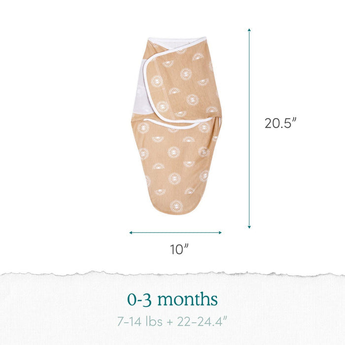 The Disney™ essentials swaddle wrap quick change 2 pack by aden + anais features a light brown wrap with a white pattern. It measures 20.5H x 10W, fits babies 0-3 months, weighing 7-14 lbs, and measuring 22-24.4 inches. Adjustable fasteners provide easy and secure swaddling.