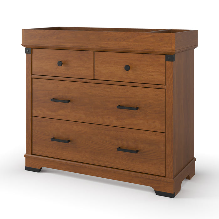 The Child Craft F01792 Universal Dressing Kit in Coach Cherry is a wooden dresser with a warm brown finish, two small top drawers with round knobs, and two larger lower drawers with rectangular handles.