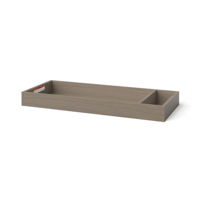 The Child Craft F01792 Universal Dressing Kit in Crescent Grey features a large and a small compartment, perfect for organizing your baby changing essentials. Ideal as a dresser topper. Shown on a white background.